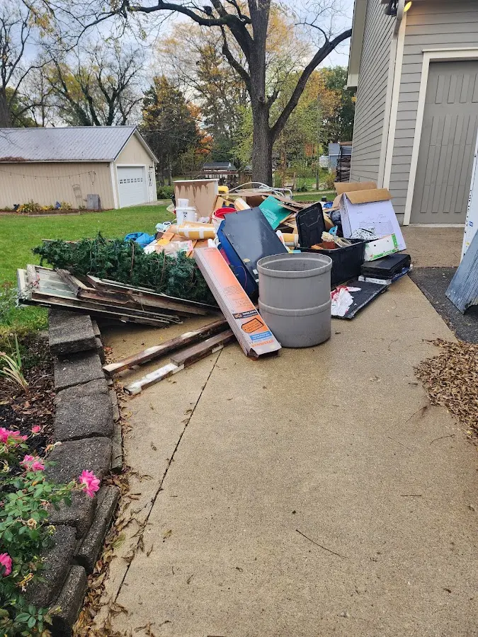 Dumpster being loaded with debris for 10 Yard Dumpster Rental in Mountain Grove